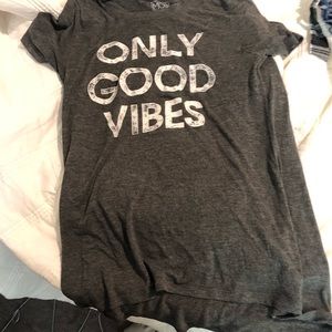 Gray and white shirt that says “good vibes only” size medium